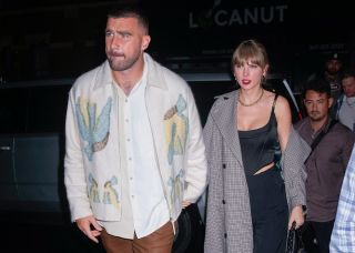 Travis Kelce and Taylor Swift entering the SNL afterparty October 14.