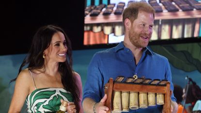 Meghan Markle wearing a green and white drop-waist dress in Colombia August 2024