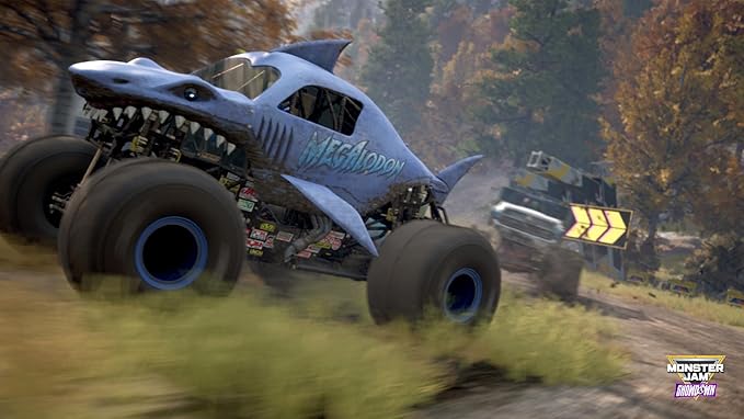 A Megalodon Monster Jam truck racing in a forest environment
