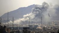 Smoke rises from buildings in Tehran, Iran, after an airstrike.