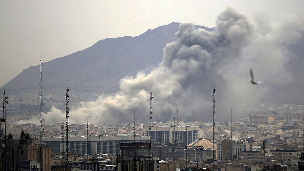 Smoke rises from buildings in Tehran, Iran, after an airstrike.
