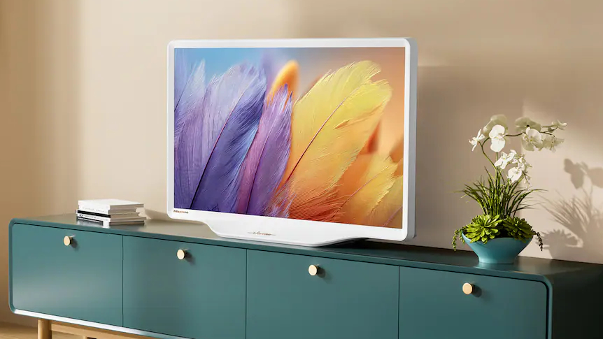 The Hisense Deco S5 TV on a teal-colored credenza displaying colorful feathers