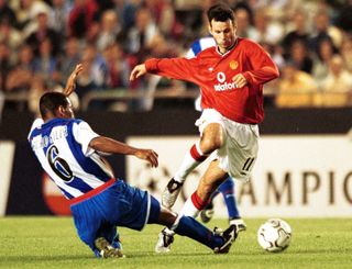 Deportivo La Coruña's Mauro Silva slides in to dispossess Manchester United's Ryan Giggs in a Champions League game in 2001.