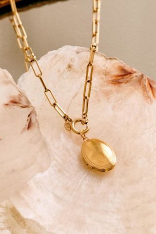 gold chain with locket charm