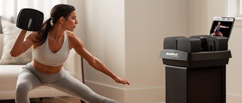 Woman using NordicTrack iSelect Voice-Controlled Dumbbells