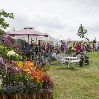 hyde hall garden with tables and chairs