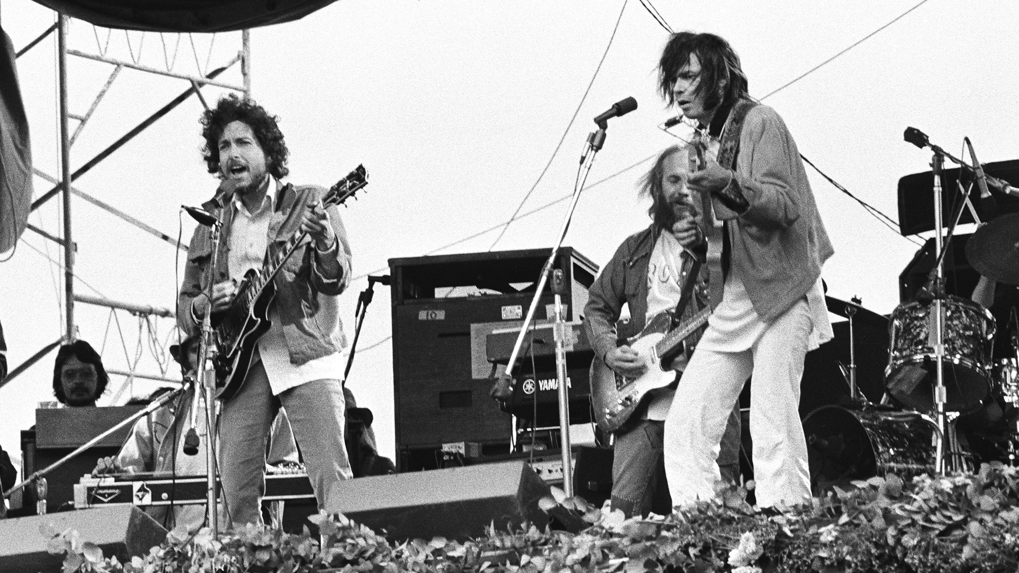 Neil Young and Bob Dylan perform at Bill Graham&#039;s SNACK Benefit (Students Need Athletics, Culture and Kicks) at Golden Gate Park on March 23, 1975 in San Francisco, California.