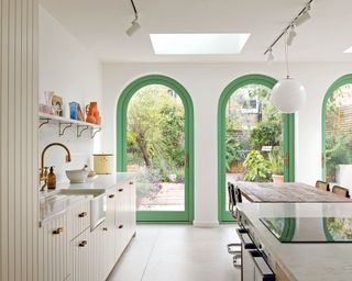 White kitchen with green painted door frames