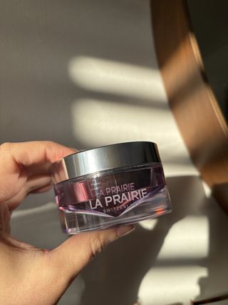 Mica Ricketts holding La Prairie Platinum Rare Haute-Rejuvenation Mask