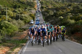 LAGOS PORTUGAL FEBRUARY 16 LR Oscar Riesebeek of Netherlands and Team AlpecinFenix Yves Lampaert of Belgium and Team QuickStep Alpha Vinyl Bert Van Lerberghe of Belgium and Team QuickStep Alpha Vinyl Luis Lhrs of Germany and Team Bora Hansgrohe Lukas Pstlberger of Austria and Team Bora Hansgrohe and Geraint Thomas of The United Kingdom and Team INEOS Grenadiers lead the peloton during the 48th Volta Ao Algarve 2021 Stage 1 a 1991km at stage from Portimo to Lagos VAlgarve2022 on February 16 2022 in Lagos Portugal Photo by Luc ClaessenGetty Images