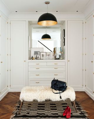 White dressing room with gold handles