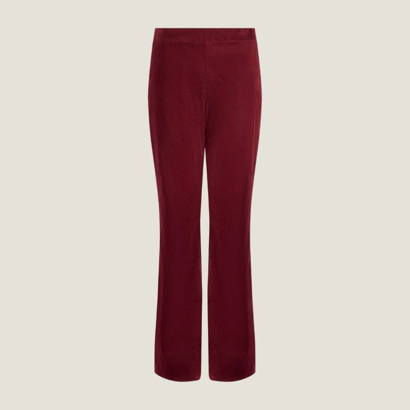 A cutout of burgundy cord trousers by Aspiga