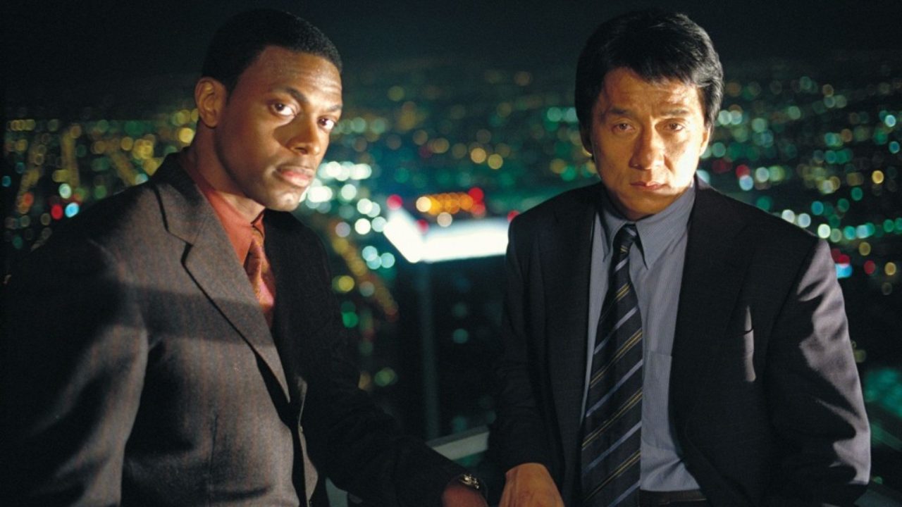 James and Lee stare directly into the camera in a press image for Rush Hour