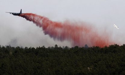 An airplane drops flame retardant over the Black Forest Fire north of Colorado Springs on June 12. 