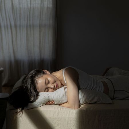 A woman sleeping; in bed