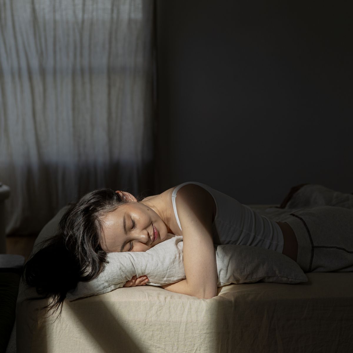 A woman sleeping; in bed