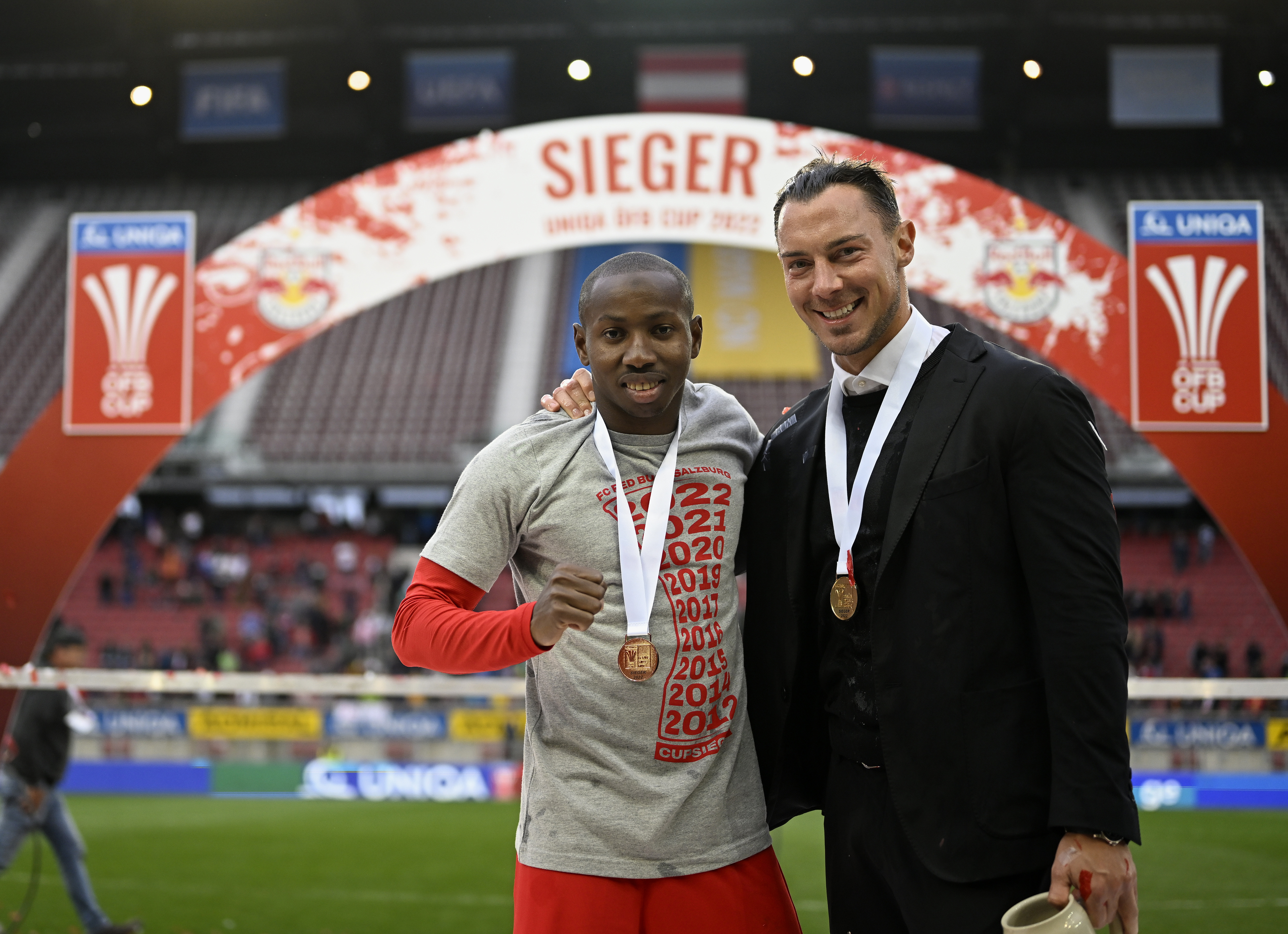 KLAGENFURT, AUSTRIA - MAY 01: Team coach Matthias Jaissle (R) and Mohamed Camara of FC Red Bull Salzburg celebrate their team&amp;amp;apos;s victory of the UNIAQ &amp;Ouml;FB Cup after the 3-0 victory of the final match between FC Red Bull Salzburg and SV Guntamatic Ried at Woerthersee Stadion on May 01, 2022 in Klagenfurt, Austria. (Photo by Andreas Schaad - FC Red Bull Salzburg/FC Red Bull Salzburg via Getty Images)
