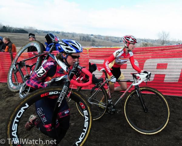 Katy Curtis (Cyclemeisters) and Mo Bruno-Roy running over the railroad ties.