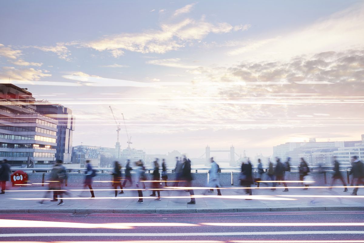 People walking through a city. 