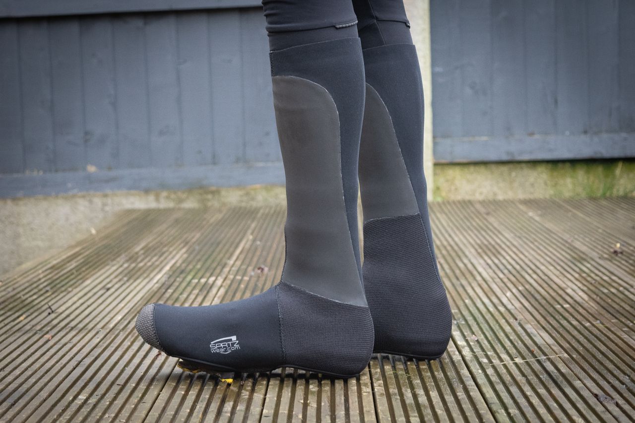 A rider wearing a pair of Spatz Pro Stealth winter overshoes