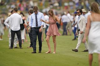 The ritual that is 'treading in' by spectators at half time during the King Power Gold Cup semi-final on Wednesday at Cowdray Park. Photo by Alan Crowhurst/Getty Images)