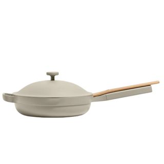 A gray Our Place Always pan with a lid and a wooden spatula
