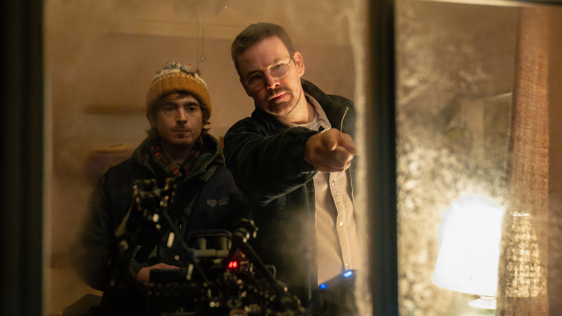 Director Zach Cregger (right) and Austin Abrams on the set of Constantin Film and Columbia Pictures RESIDENT EVIL. Photo by: Du&amp;scaron;an Martin&amp;#269;ek