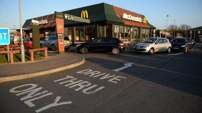 Long queues outside a McDonald's restaurant and drive thru prior to closure on March 23, 2020 in Weymouth, United Kingdom. Coronavirus (COVID-19) pandemic has spread to at least 182 countries, claiming over 10,000 lives and infecting hundreds of thousands more.