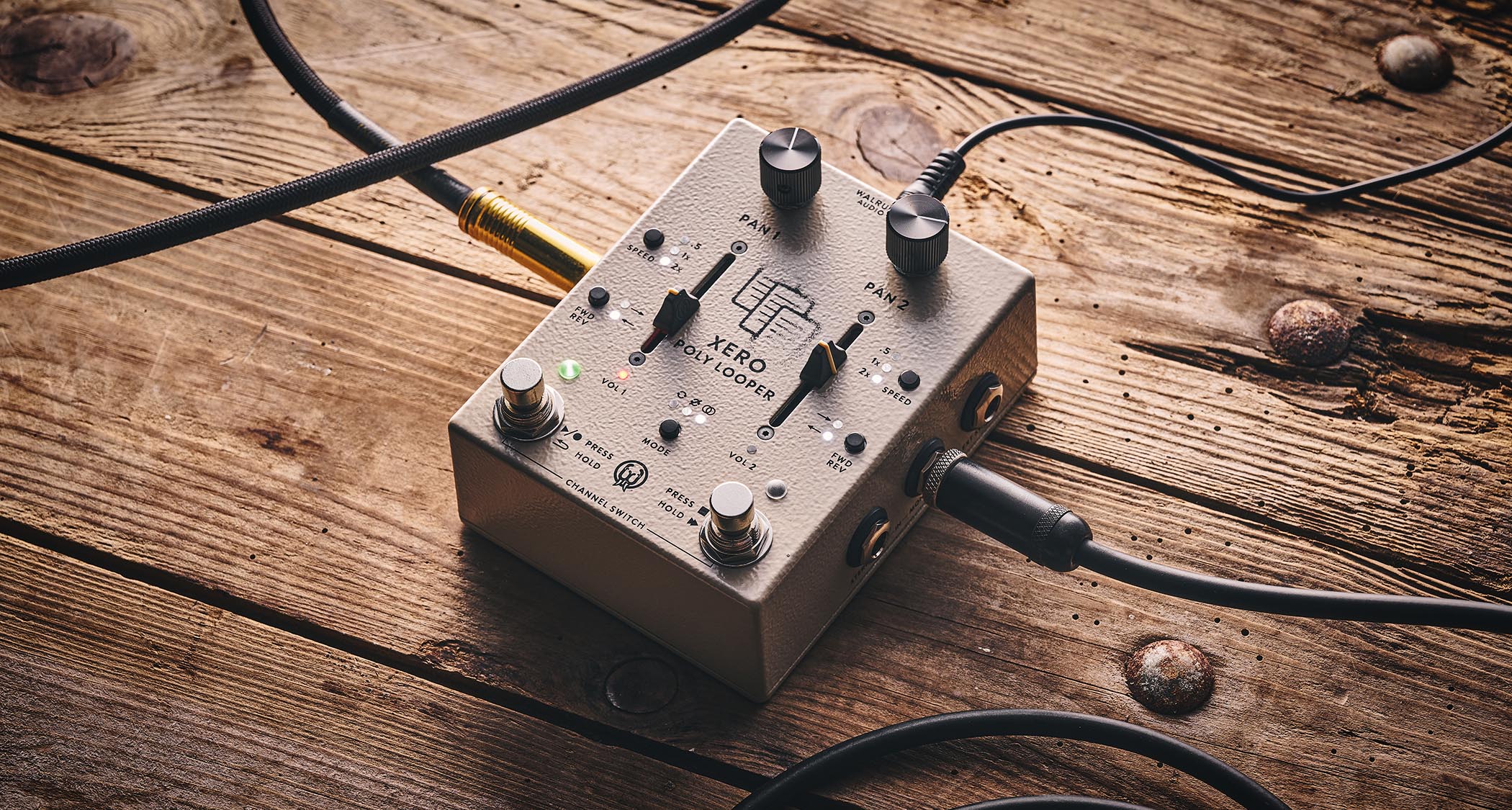 Walrus Audio Xero Polylooper: the dual-slider and footswitch looper is photogaphed against a wooden floor.