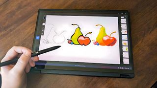 ASUS ProArt PX13 drawing in tablet mode.