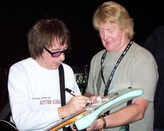 Bill Wyman signs Brian's guitar