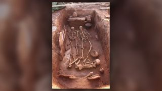A man, two women and an infant were buried in this grave about 2,500 years ago in what is now Siberia.