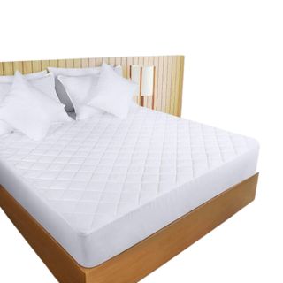 A mattress topper on a wooden bed
