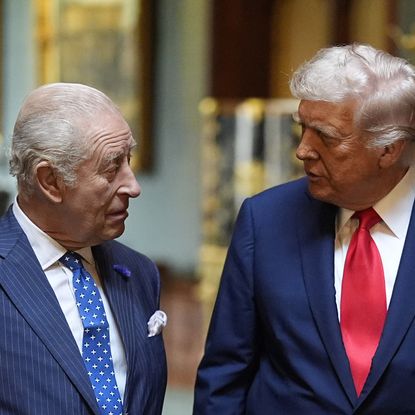 King Charles and Donald Trump wearing suits and ties looking at each other