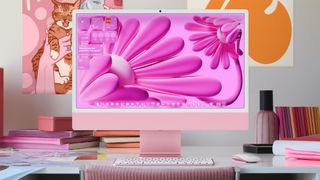 macOS Tahoe pink desktop on iMac