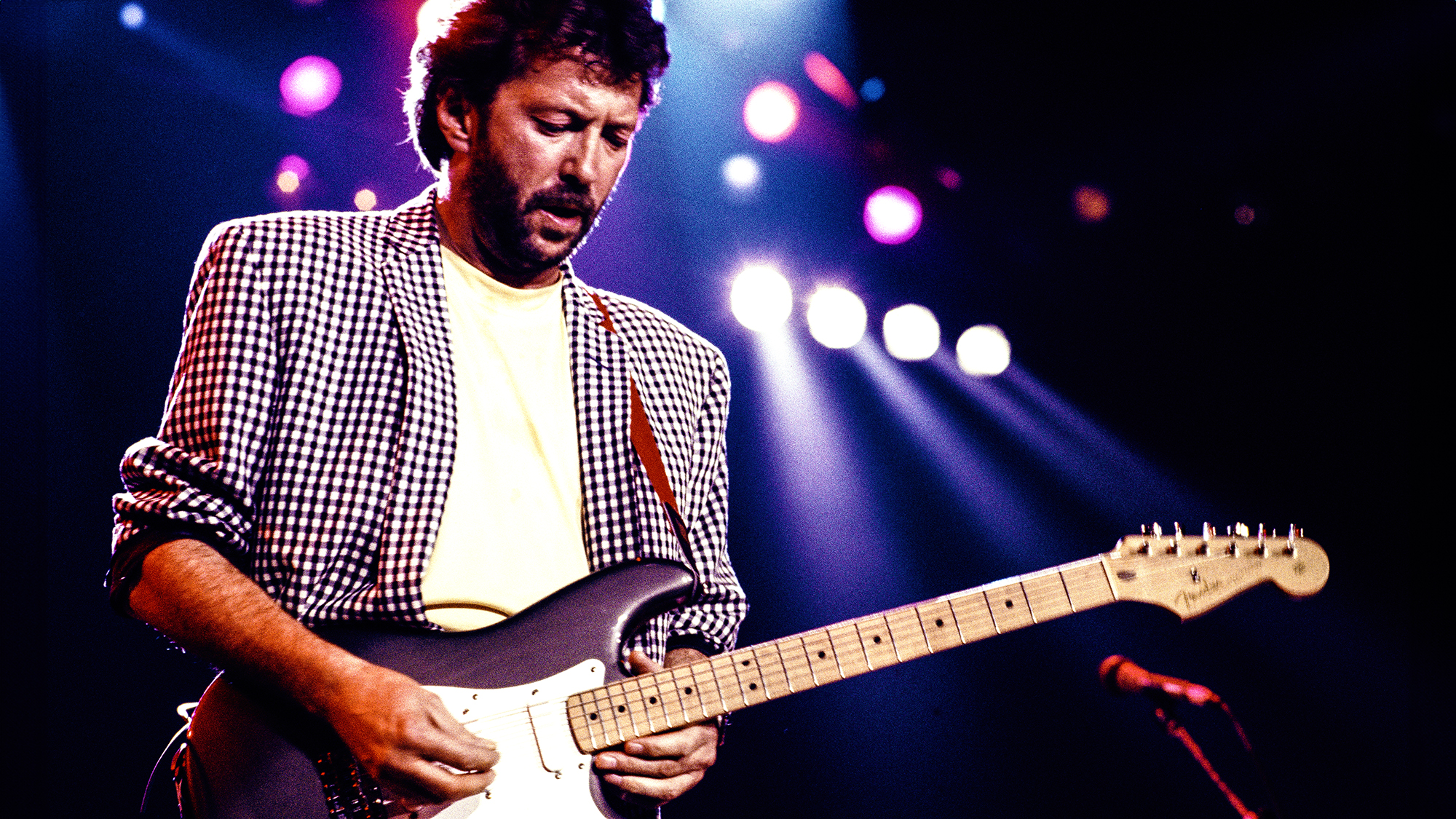English guitarist Eric Clapton performing on stage at The Prince's Trust all-star Rock Gala at Wembley Arena, London, 5th June 1987. 