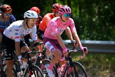 FRANCAVILLA AL MARE ITALY MAY 15 LR Rui Oliveira of Portugal and Tadej Pogacar of Slovenia and UAE Team Emirates Pink Leader Jersey ride whilst eating during the 107th Giro dItalia 2024 Stage 11 a 207km stage from Foiano di val Fortore to Francavilla al mare UCIWT on May 15 2024 in Francavilla al mare Italy Photo by Dario BelingheriGetty Images
