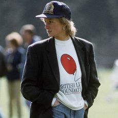 Princess Diana wearing a blazer and baseball cap