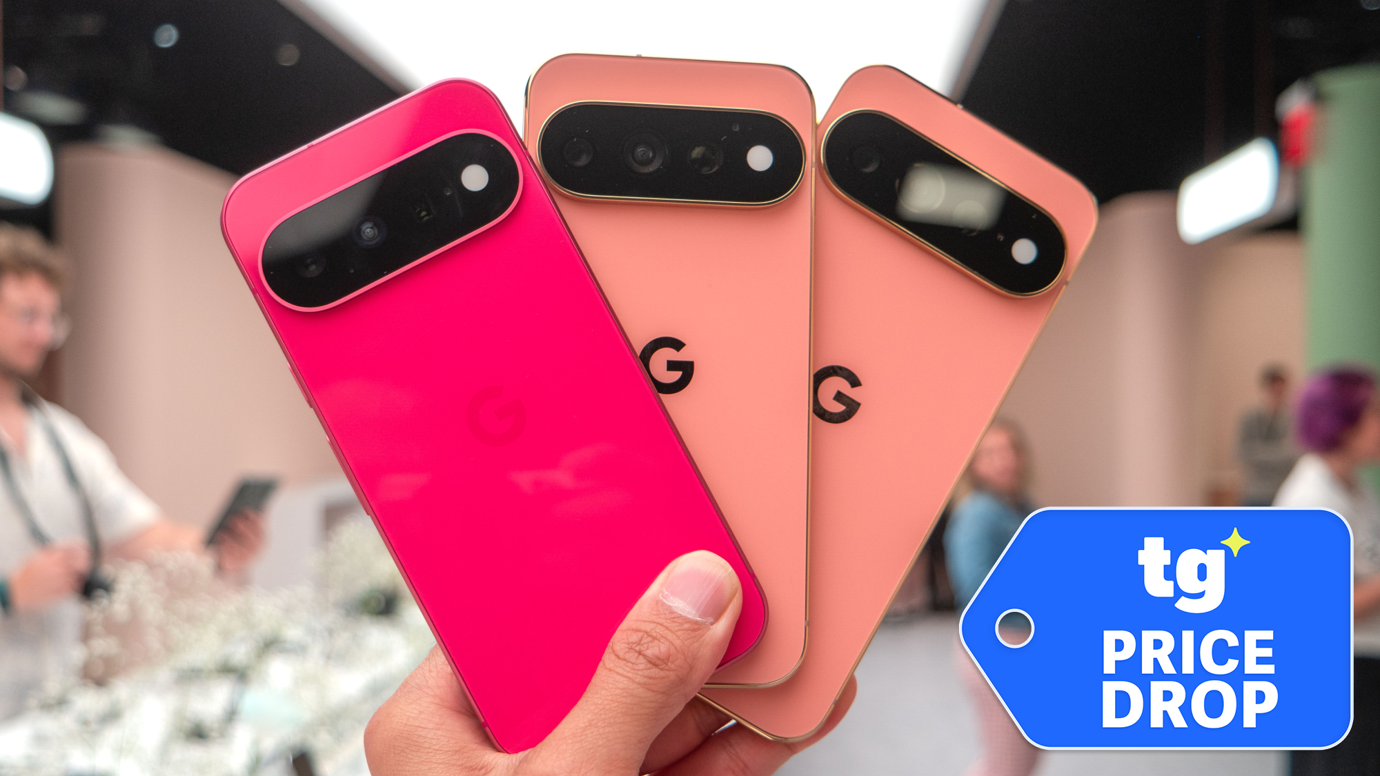 Three Pixel 11 phones held in hand