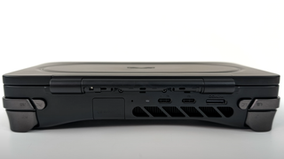 A shot of the rear of a closed Ayaneo Flip DS, highlighting its thickness relative to its included USB-C and OCuLink ports.