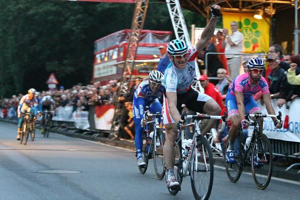 Greipel with arm aloft celebrates his win.