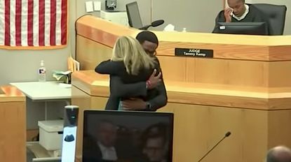 Brandt Jean embraces the cop who murdered his brother