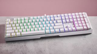 Front of Cherry XTRFY MX 3.1 on desk on with pink background