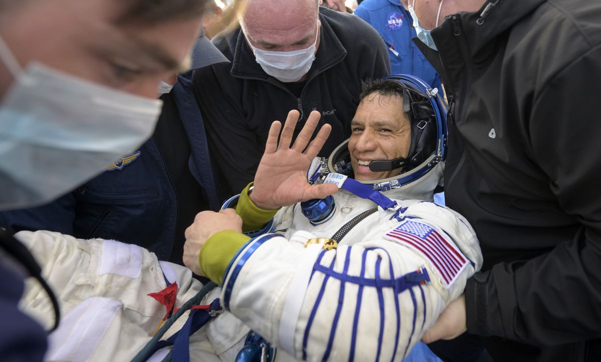 Astronauts return after circling Earth thousands of times while stuck