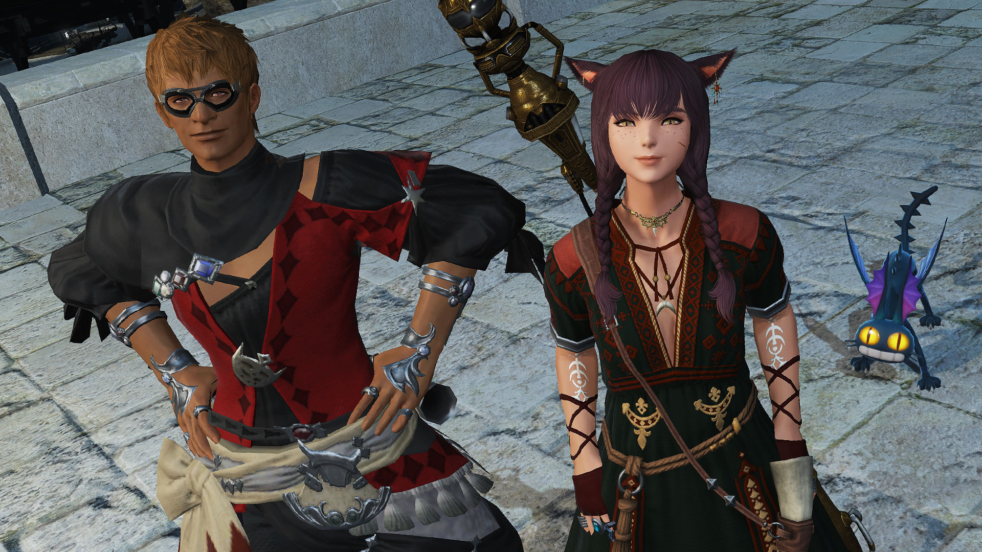 Final Fantasy 14 - A miqo'te Warrior of Light standing beside the Wandering Minstrel during a seasonal event