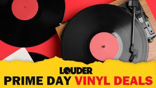The main image for Louder's Amazon Prime Day vinyl deals hub showing an overhead view of a wooden turntable, along with two 12-inch records