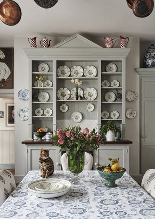 Penny Morrison's dining room with shelves filled with plates