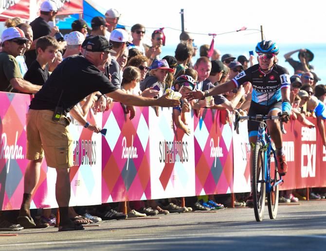 Caroline Mani (Raleigh Clement) is congratulated by announcer Richard Fries after completing the race with a broken wrist.