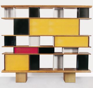 A bookcase featuring modules in primary colours.