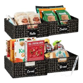 A set of four black woven storage baskets with labels